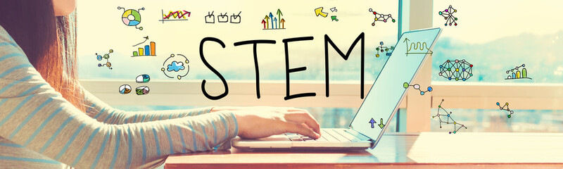 STEM with woman working on a laptop in brightly lit room © Tierney