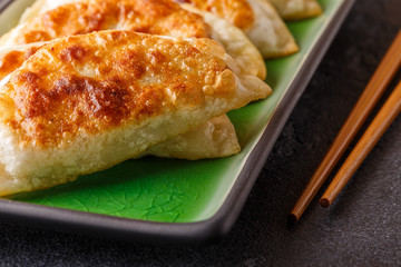 Plate of asian gyoza, dumplings snack.