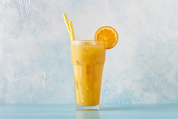 Cocktail with orange juice and ice cubes
