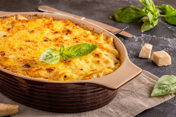 Mac and cheese, american style macaroni pasta in cheesy sauce.
