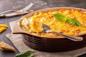 Mac and cheese, american style macaroni pasta in cheesy sauce.