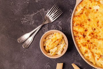 Mac and cheese, american style macaroni pasta in cheesy sauce.