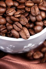 roasted coffee beans in a cup