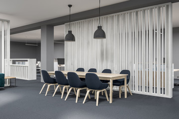 Wooden meeting room corner, black chairs