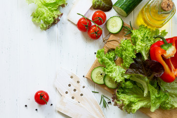 Ingredients cooking for summer salad on a white kitchen table. The concept of nutrition health. Copy space, top view flat lay background.