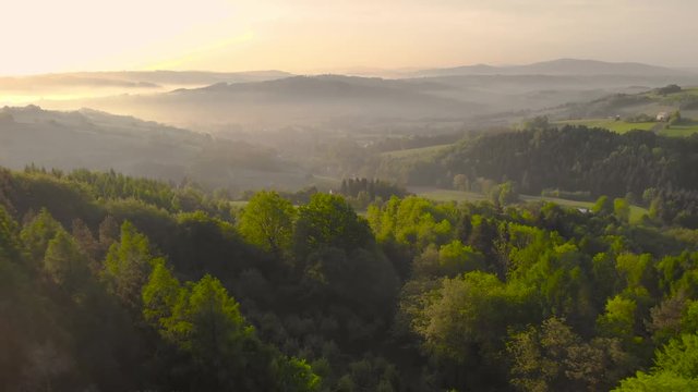 Beautiful sunrise in hills and countryside in lesser Poland,Drone fly backwards.