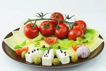Tomatoes, cheese, with olives and lettuce
