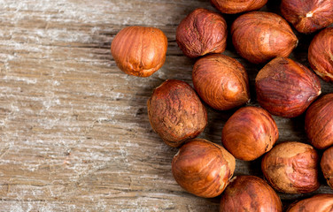Hazelnuts on a wooden background