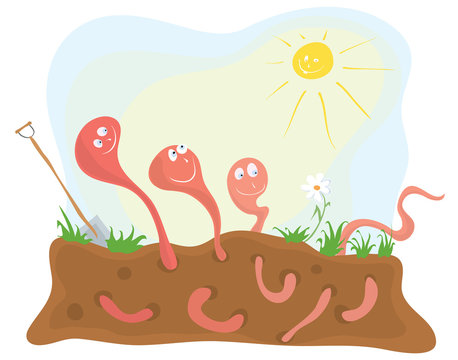 break during work day/ Cheerful earthworms under  warming  sun on the flower bed