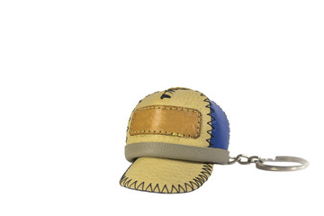 leather cap keychain on white background