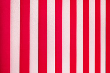 Texture of white and red stripes. Vertical blinds on  window_