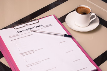 Curriculum vitae cv and a cup coffee