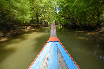 Long tail boat with motion blur