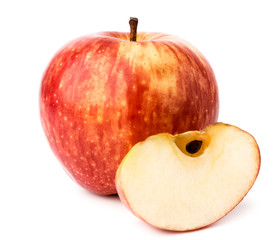 Ripe red Apple and a piece on a white. isolated.