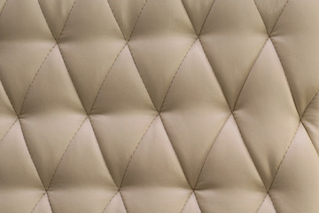 beige leather sofa with buttons texture background