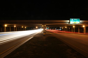 Traffic Traveling East and West along Sample Road in Pompano Beach at Night under the I-95 Overpass...