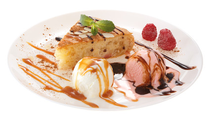 Apple biscuit cake and ice cream on plate isolated on white background