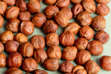 Hazelnuts on a green background