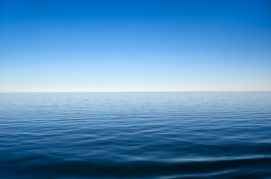Fototapeta Panorama of sea waves against the blue sky