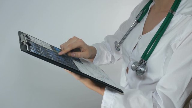 doctor checks the results of the survey