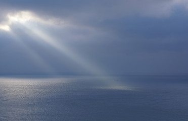 A ray of the sun lit up the sea.