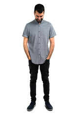 Fototapeta premium Handsome man standing and looking down