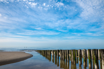 Groyne Pillars At Beautiful Lonely Beach Of Domburg With Waterreflections - Zeeland