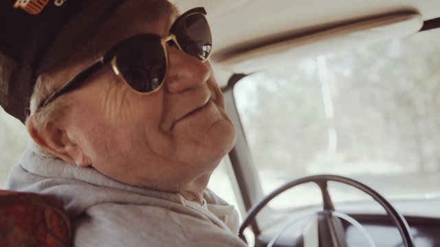 Back Angle View Of Old Man Sends Hello At Camera And Comes Out From Car