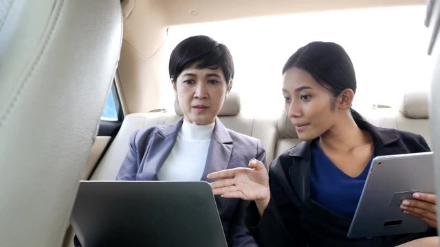 Asian people working together inside car. People working concept. 