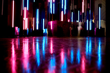 The reflection of blue and pink light at the surfaces. The atmosphere of the club, the parties. Twilight