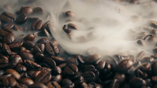 Smoke Wafting Over Roasted Coffee Beans