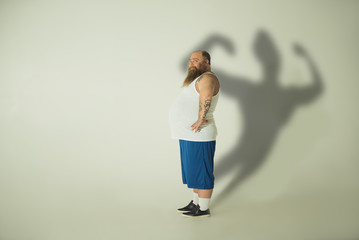 Man's shadow is different than how he actually looks