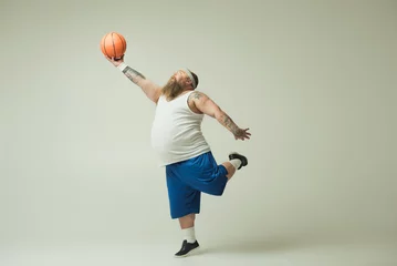 Foto op Canvas Man holding basketball © Yakobchuk Olena