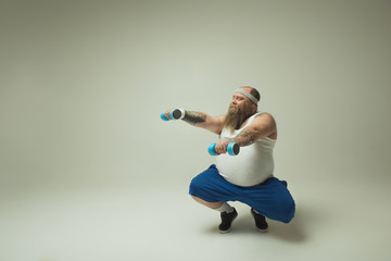 Man exercising with dumbbells