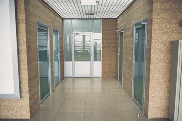 Modern different doors situating opposite each other in business center