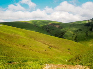 Fototapeta premium Green mountain landscape and blue sky
