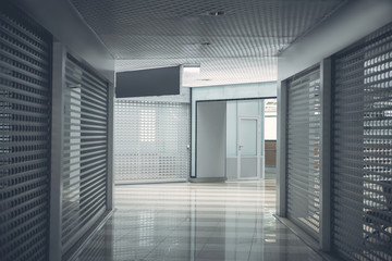 Design of door at end of huge dark contemporary hallway in gray color