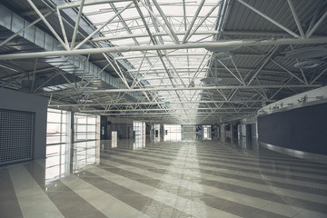 Design of light hall with grey door and concrete floor