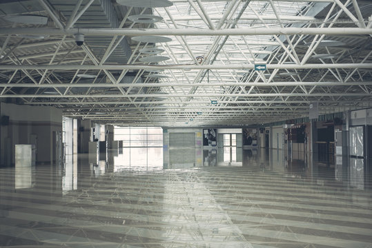 Interior of grey big empty warehouse complex with pendant lamps