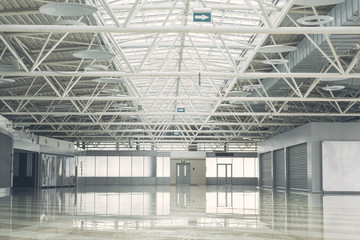 Big empty building inside with wide windows for renting it. - obrazy, fototapety, plakaty