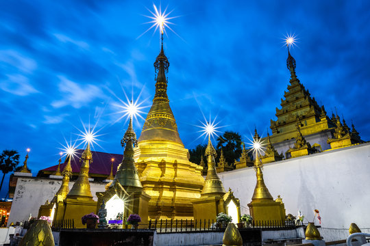 Golden Pagoda, Buddhist architecture Wat Thai Watthanaram at dusk, Mae Sot, Tak, Thailand