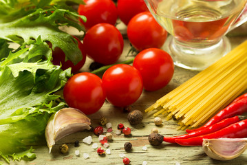 Cooked pasta with tomatoes and seasonings.