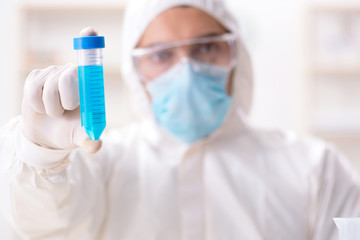 Fototapeta premium Young chemist student working in lab on chemicals