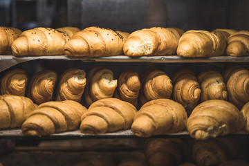 A lot of fresh homemade croissants Sold in a small bakery
