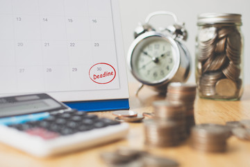 Tax payment season and finance debt collection deadline concept. Money coins stack, calendar,...