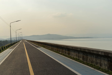 Fototapeta premium Run Exercise Road on dam Mountain View