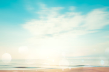 Fototapeta na wymiar A seascape abstract beach background. panning motion blur and bokeh light of lens flare, pastel colors in a vintage and retro style.