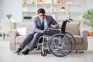 Dsabled businessman on wheelchair working home