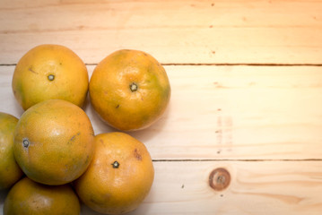 tangerine orange on wood