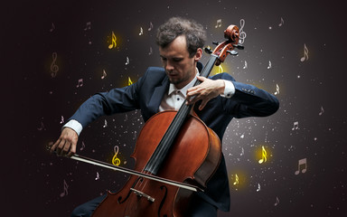 Fototapeta premium Young cellist with falling musical notes wallpaper and classical concept